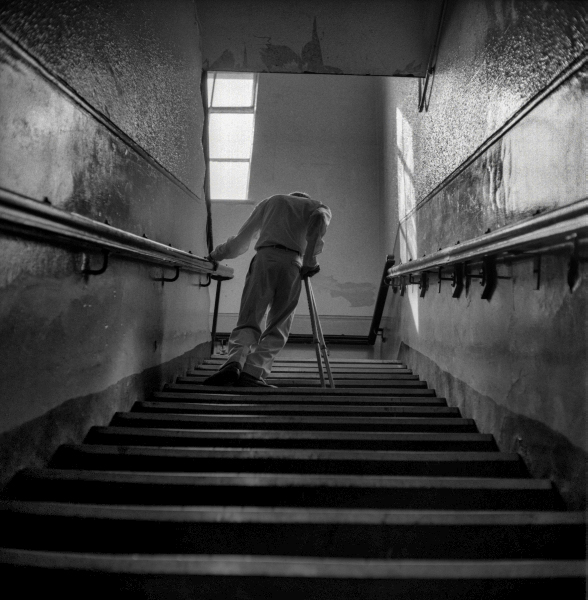 Disabled man using steps at Mill Hill Community Centre, Blackburn
