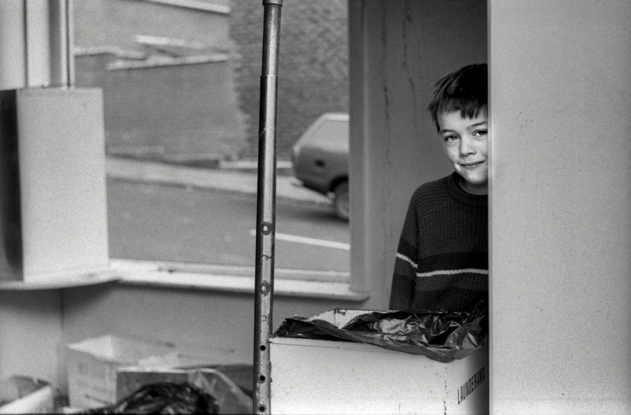 Child playing in arsoned laundry, off Montague Street, Blackburn 1984