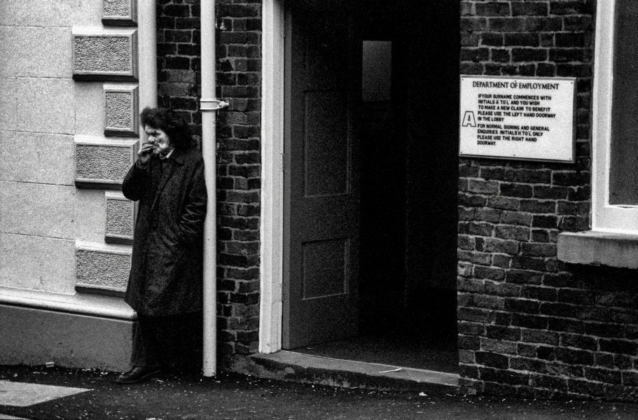 Man outside Unemployment Office - Blackburn - A Town and its People by Christopher John Ball