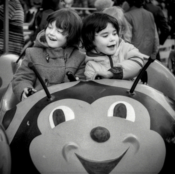 Children on Easter Fair Ladybird Ride - Blackburn - A Town and its People by Christopher John Ball