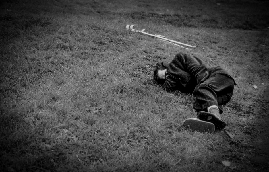 Man with crutches sleeping on grass - Blackburn - A Town and its People by Christopher John Ball