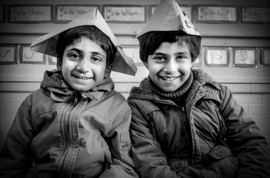 Two boys wearing paper hats at Brookhouse Community Centre - Blackburn - A Town and its People by Christopher John Ball