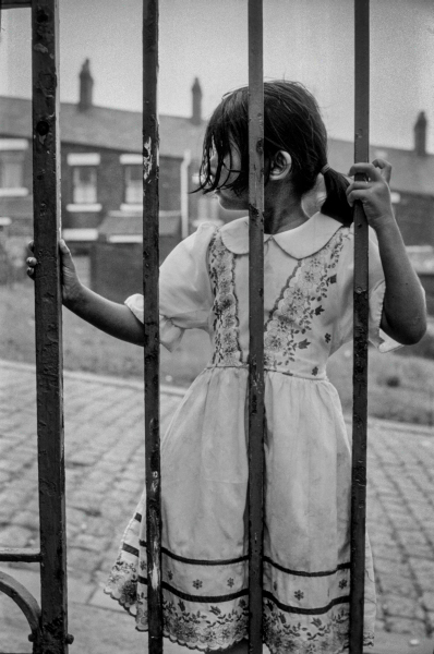 Young girl by railings at Brookhouse Community Centre - Blackburn - A Town and its People by Christopher John Ball