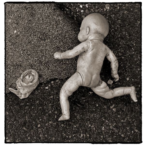 Doll and Condom from Discarded: Photographic Essay by Christopher John Ball - Photographer & Writer