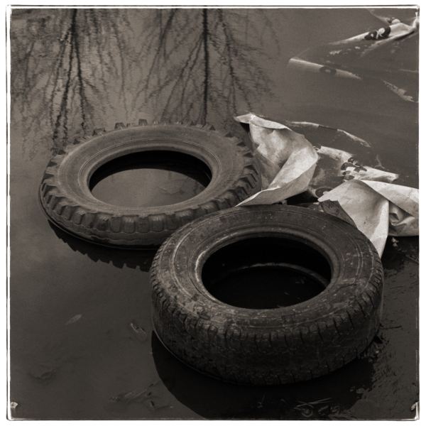 Tyres in Pond from Discarded: Photographic Essay by Christopher John Ball - Photographer & Writer