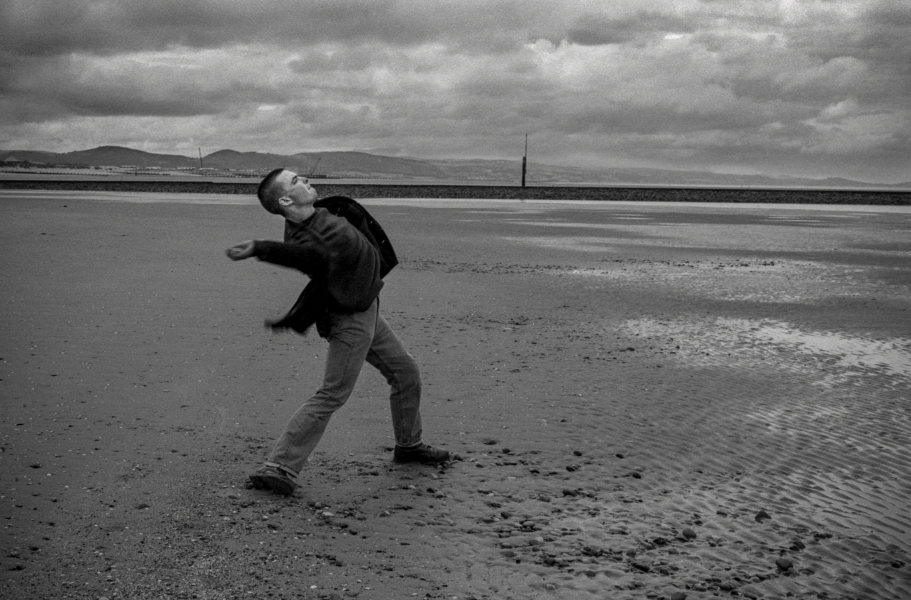 Throwing Stones on Beach, Llandudno, 1992 From British Coastal Resorts - Photographic Essay by Christopher John Ball